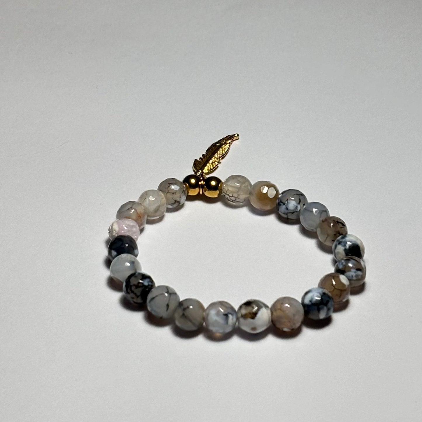 pulsera la pluma