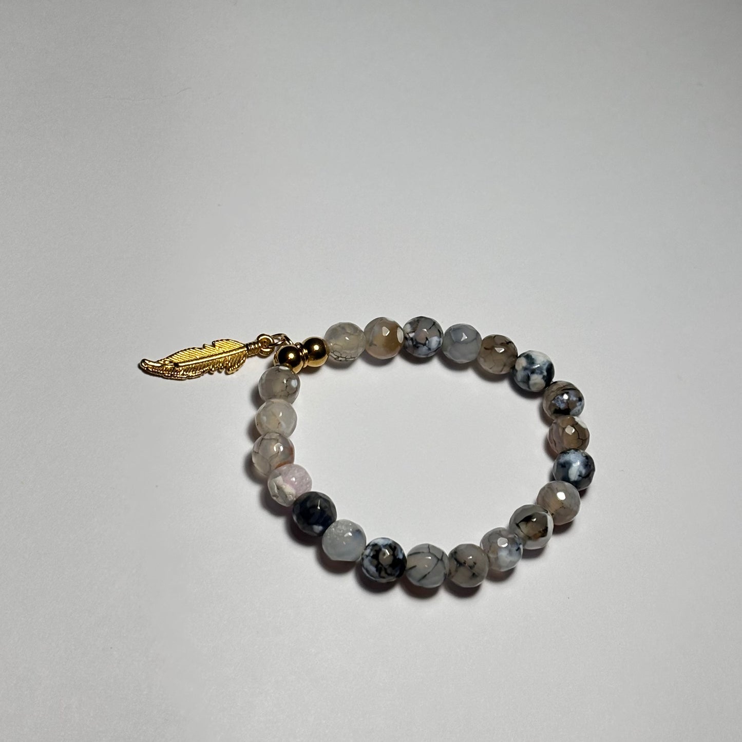 pulsera la pluma